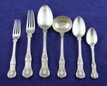 A matched part canteen of Victorian silver Queens pattern flatware, with engraved armorial,