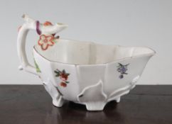 A Chelsea strawberry leaf sauceboat, c.1752-55, decorated with flowers and insects, 6in.
