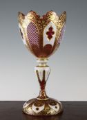 A Bohemian ruby and white overlaid glass vase, late 19th century, with lancet and strawberry cut