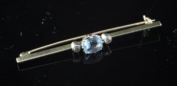 A gold, aquamarine and two stone diamond bar brooch, 2.5in.