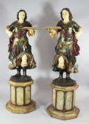 A pair of late 19th century Italian carved wood and polychrome standing Blackamoor type figures,