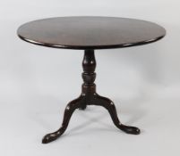 A George III circular mahogany tripod table, with baluster turned and half twisted carved central