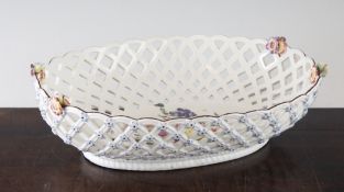 A Chelsea oval trellis pattern, c.1760-4, with floral decoration, red anchor mark, lacks handles,