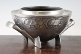 An Archibald Knox Liberty Tudric pewter two handled bowl, 0229, decorated with stylised floral