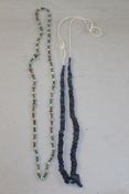 A Roman glass bead necklace and an Egyptian bone and glass bead necklace, both re-strung, 10.5 and