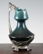 A German Art Nouveau pottery and pewter jug, by J. Von Schwartz, the pottery jug with impressed