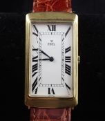 A gentleman`s stylish 18ct gold Ebel manual wind wrist watch, with tumbling Roman numeral dial, on