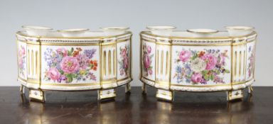 A pair of Paris porcelain demi-lune bough pots, early 19th century, by Housel, each painted with