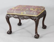 A George III style mahogany rectangular foot stool, with acanthus scroll decoration, on cabriole