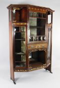 An Edwardian Art Nouveau mahogany and marquetry inlaid display cabinet, with pierced stylised floral