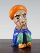 A Clarice Cliff figure of a seated Arab, Wilkinson Ltd England printed mark only, 5.3in.