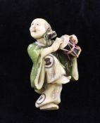A fine Japanese inlaid ivory netsuke, of a Shinto priest drumming, early 20th century, with