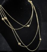 A Victorian gold guard chain, with eight intermittent oval gold beads with cannetile decoration,