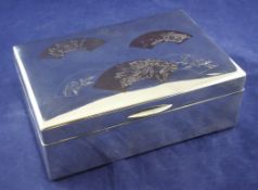 An early 20th century Meiji period Japanese two colour silver mounted hardwood cigarette box, of