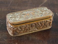 A 19th century French carved boxwood oblong snuff box, decorated in the manner of Jean Berain,