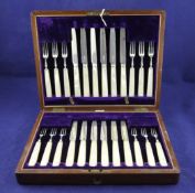 A cased set of twelve pairs of Edwardian mother of pearl handled silver dessert eaters, Allen &