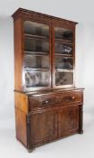 A William IV mahogany secretaire bookcase, fitted with a pair of glazed doors over a single