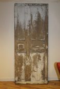 A 19th century French painted oak door, with six fielded panels, 7ft 7in. x 3ft 2.5in.