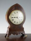 A Regency style mantel clock, with ebony strung mahogany case, enamelled Roman dial and early 19th