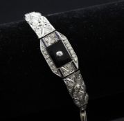 A 1920`s white gold, sapphire diamond and quartz set bracelet, (converted from a wrist watch),