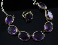 A Victorian silver gilt and amethyst fringe necklace and a 9ct gold and amethyst ring, both set with