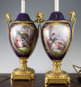 A pair of Sevres style porcelain ormolu mounted table lamps, each of oviform, painted with