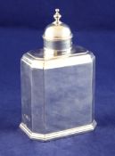 A George V plain silver tea caddy,, of rectangular form, with canted corners and domed cover,