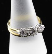 A gold three stone diamond ring soldered together with a 22ct gold wedding band, the total diamond