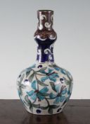 A William De Morgan Persian style pottery bottle vase, Fulham period, c.1888-1897, decorated in