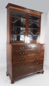 A George III mahogany secretaire bookcase with astragal glazed doors over fall-front drawer and