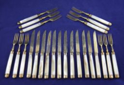 Twelve matched pairs of early 19th century French and later English mother of pearl handled silver
