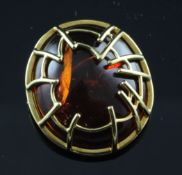 A 1990`s 18ct gold mounted amber brooch, 1.25in.