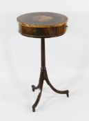 A 19th century circular mahogany occasional drum table, with four frieze drawers, on fluted