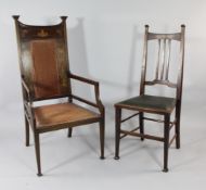 An Art Nouveau inlaid mahogany elbow chair, with part padded back and seat, tapered legs and