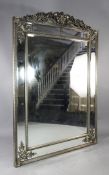 A large 19th century silvered wall mirror, with pierced floral and acanthus scroll crest, H.6ft