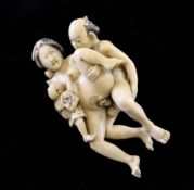 A Japanese ivory erotic group, Meiji period, 3.8in.; his arm re-stuck