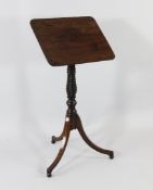 A Regency mahogany and ebony inlaid adjustable reading stand, with carved twist baluster column