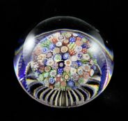A Baccarat close packed mushroom paperweight, 19th century, decorated with complex canes, with a