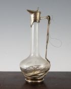 An Orivit Frederich Adler Art Nouveau pewter and glass liqueur decanter, marks to the base, 9in.