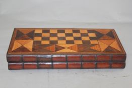 A 19th century specimen wood games box, with chess and backgammon boards modelled as two books