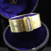 A Victorian 15ct gold, diamond and blue enamelled bracelet, set with row of old and rose cut stones,