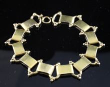 A gold foliate engraved rectangular link bracelet, 17.2 grams, 8in.