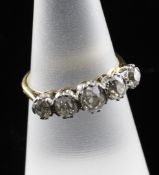 An 18ct gold, platinum and graduated five stone diamond ring, total diamond weight approximately