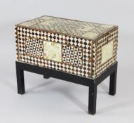 A 19th century Ottoman mother of pearl and tortoiseshell inlaid casket on stand, with sliding lid,
