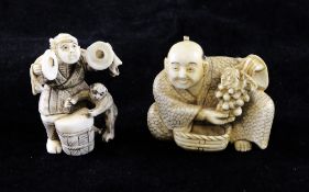 Two Japanese ivory netsuke, early 20th century, the first of a street performer with a monkey, two