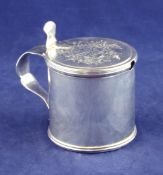 A George III silver drum mustard, with elaborate engraved armorial, WL below a fish, (unidentified