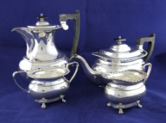 A 1930`s silver four piece tea set, of oval form, with decorated borders, on lions paw feet, Viner`s