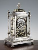 A late 19th century French silvered bronze and champleve enamel mantel clock, with architectural