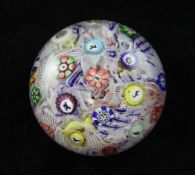A Baccarat spaced millefiori paperweight, initialled B and dated 1848, with silhouette canes of a