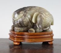 A Chinese celadon and grey jade figure of a recumbent elephant, its head turned to the right, 4.